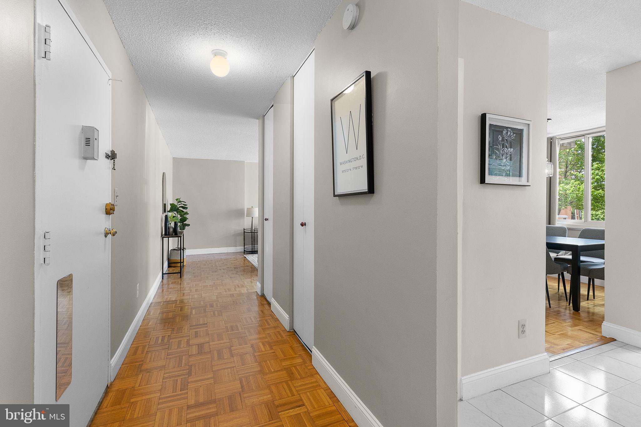 1301 South Arlington Ridge Road, Unit 208 Arlington, VA 22202 - Photo 16 of 23 a view of a hallway with wooden floor and staircase