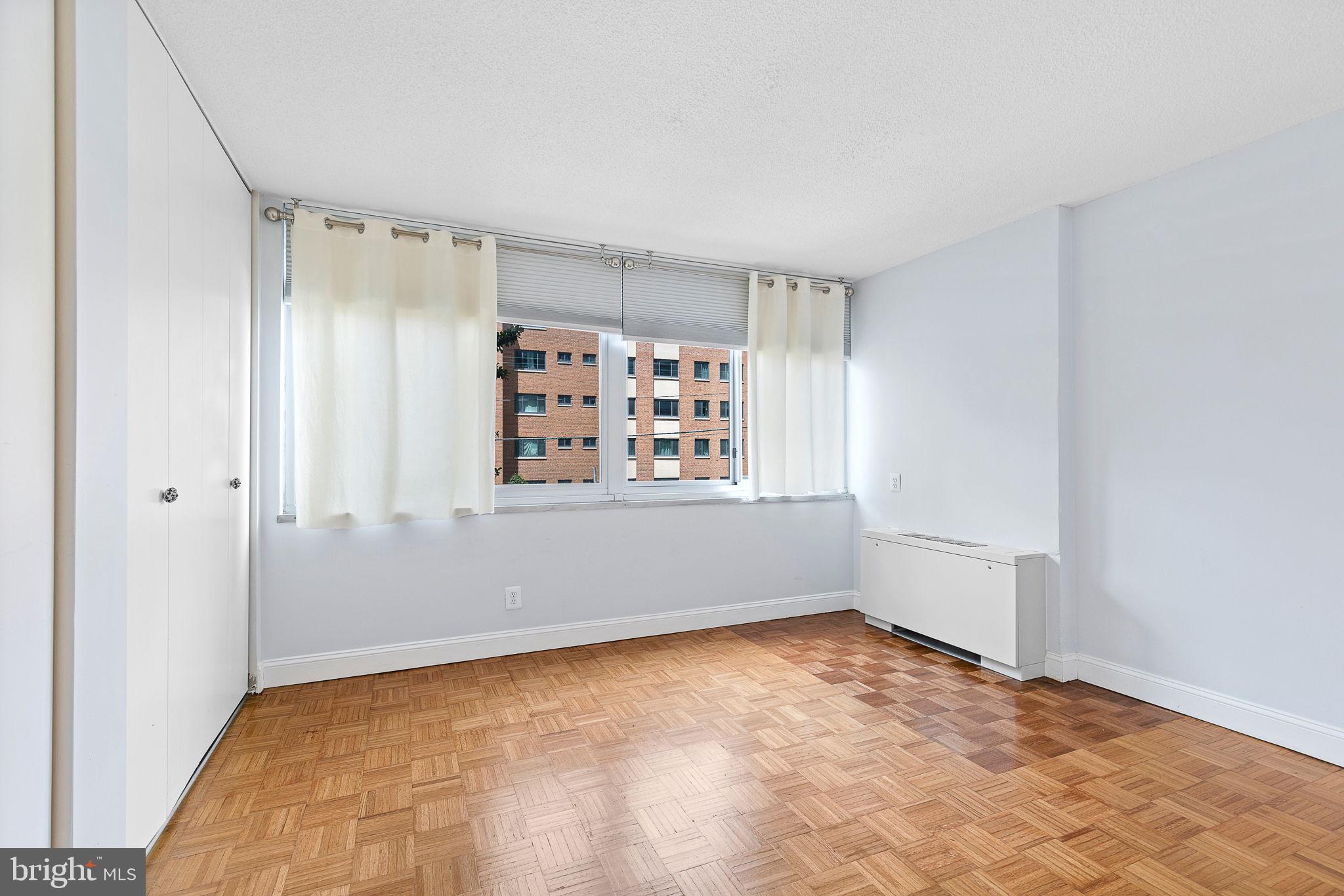 1301 South Arlington Ridge Road, Unit 208 Arlington, VA 22202 - Photo 20 of 23 a view of an empty room with a window