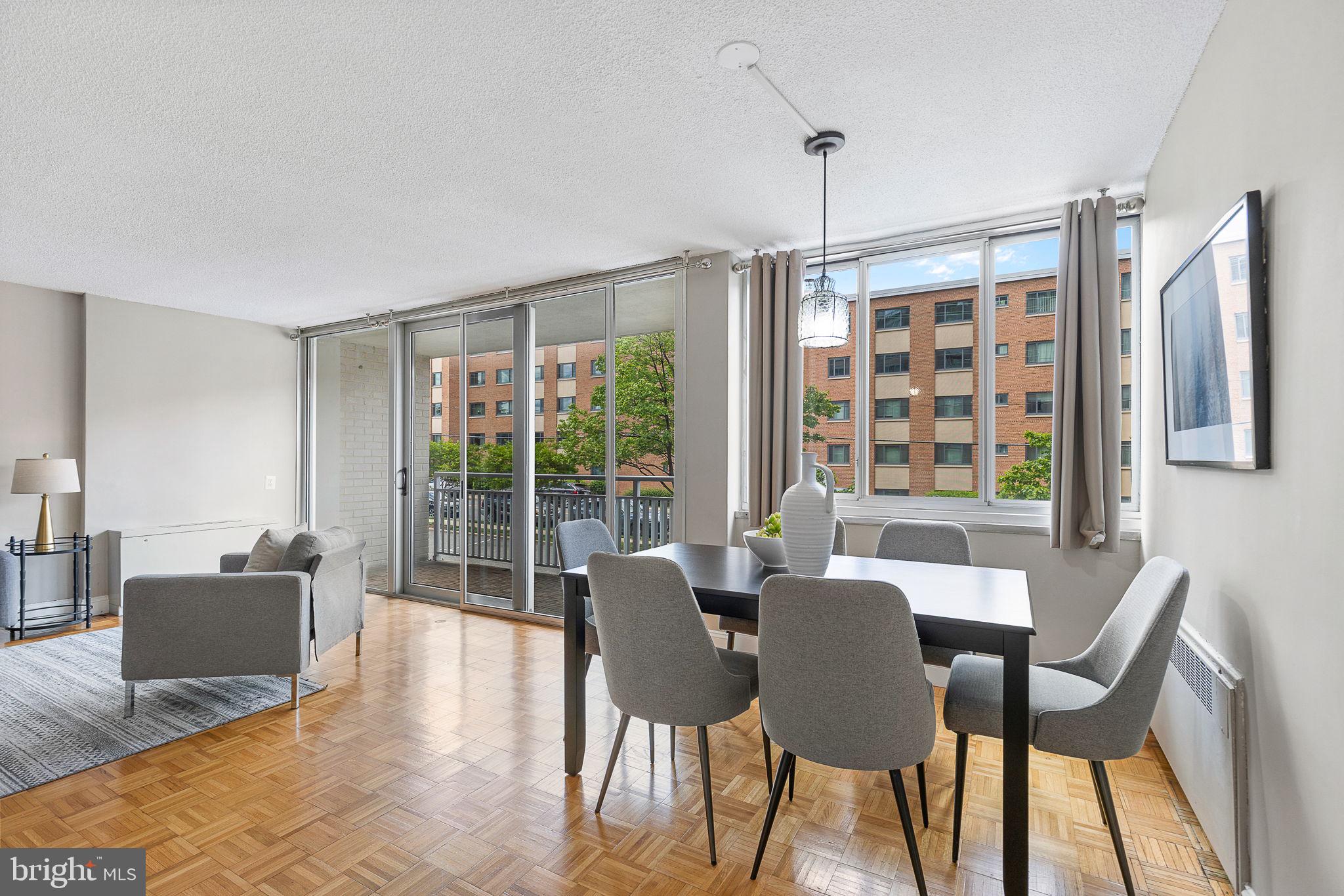 1301 South Arlington Ridge Road, Unit 208 Arlington, VA 22202 - Photo 2 of 23 a view of a dining room with furniture window and outside view