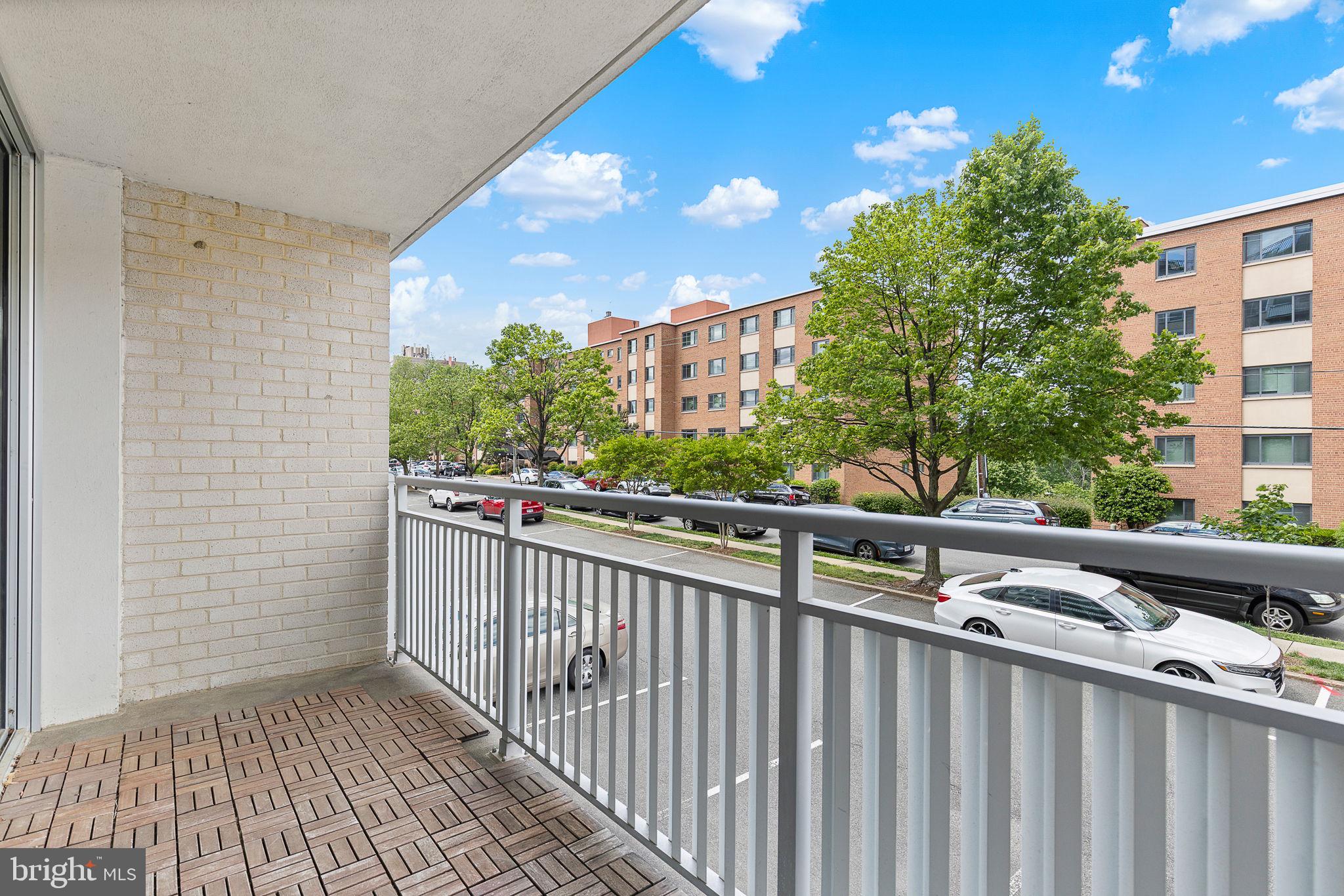 1301 South Arlington Ridge Road, Unit 208 Arlington, VA 22202 - Photo 22 of 23 a view of a balcony with wooden floor and city view