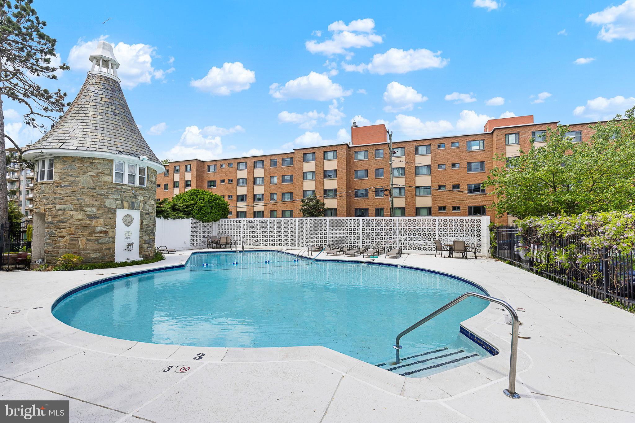 1301 South Arlington Ridge Road, Unit 208 Arlington, VA 22202 - Photo 5 of 23 a view of a house with swimming pool and sitting area