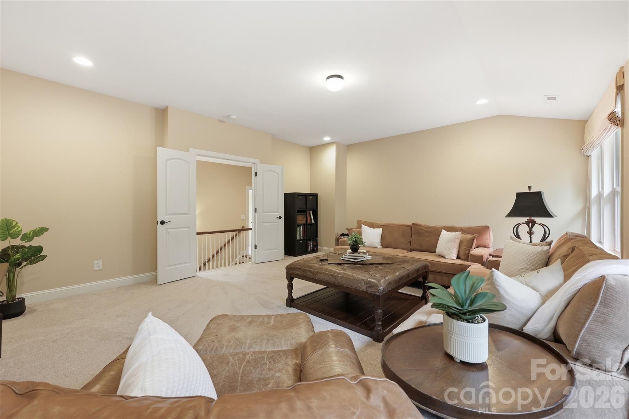 8094 Clems Branch Road Indian Land, SC 29707 - Photo 20 of 38 a living room with furniture and a chandelier