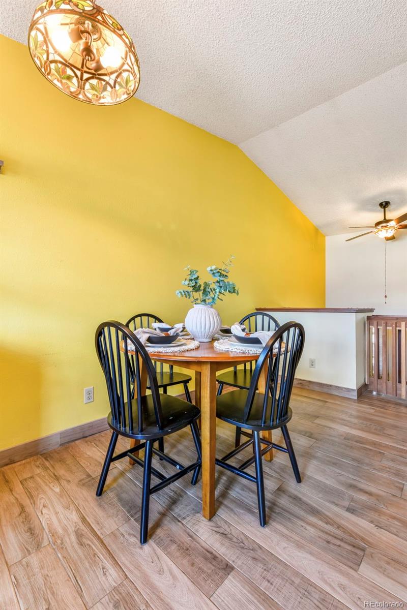 463 Washington Street Monument, CO 80132 - Photo 12 of 50 a view of a dining room with furniture and wooden floor