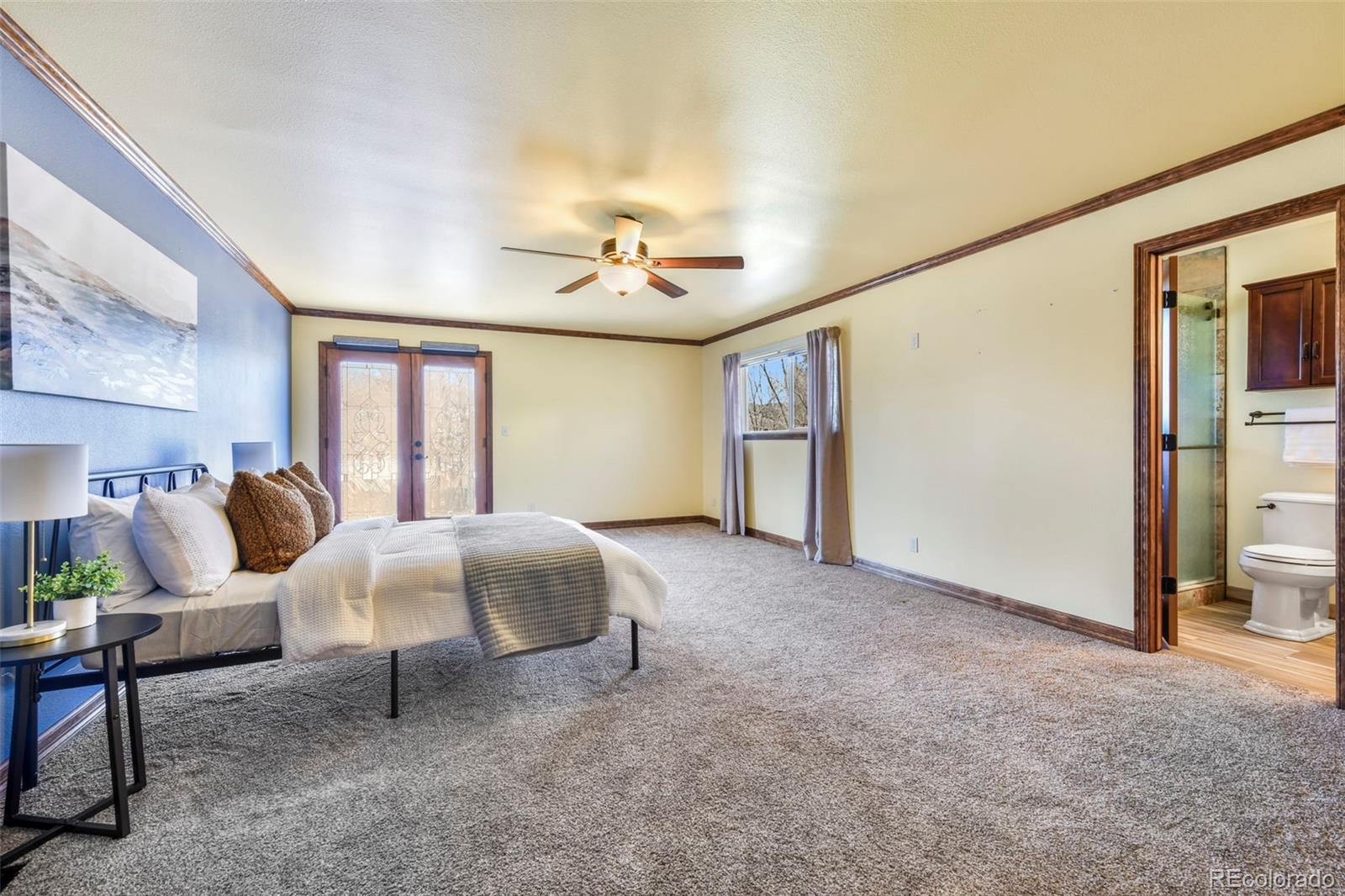 463 Washington Street Monument, CO 80132 - Photo 15 of 50 a living room with furniture and a chandelier