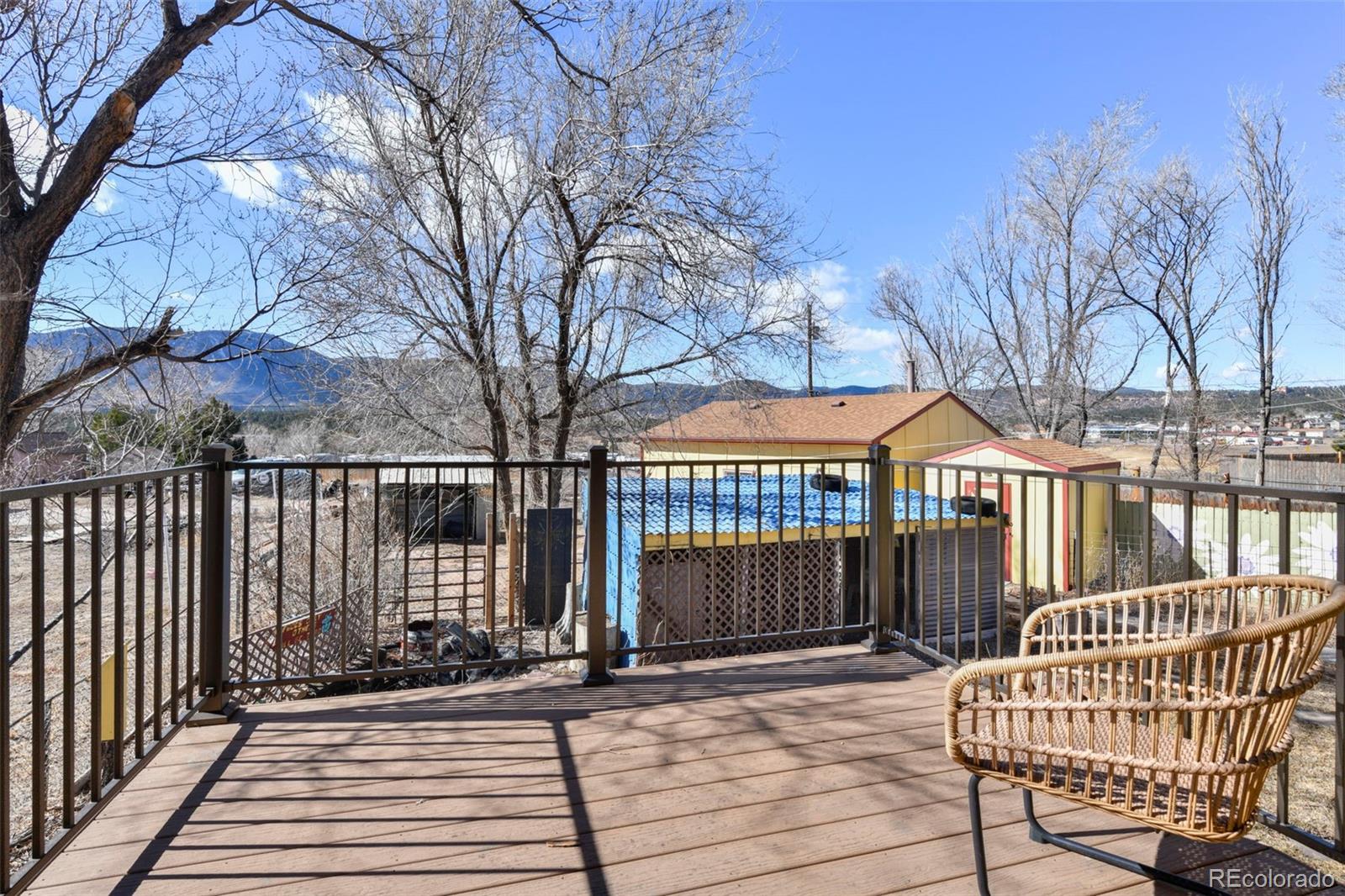 463 Washington Street Monument, CO 80132 - Photo 17 of 50 a view of a house with a wooden fence