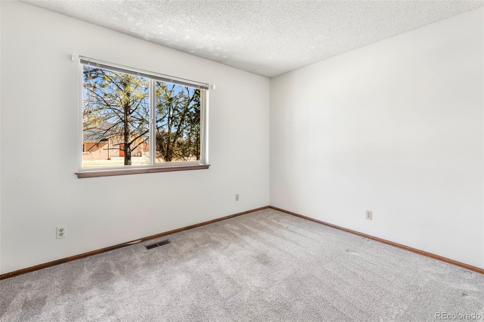 463 Washington Street Monument, CO 80132 - Photo 18 of 50 an empty room with a window