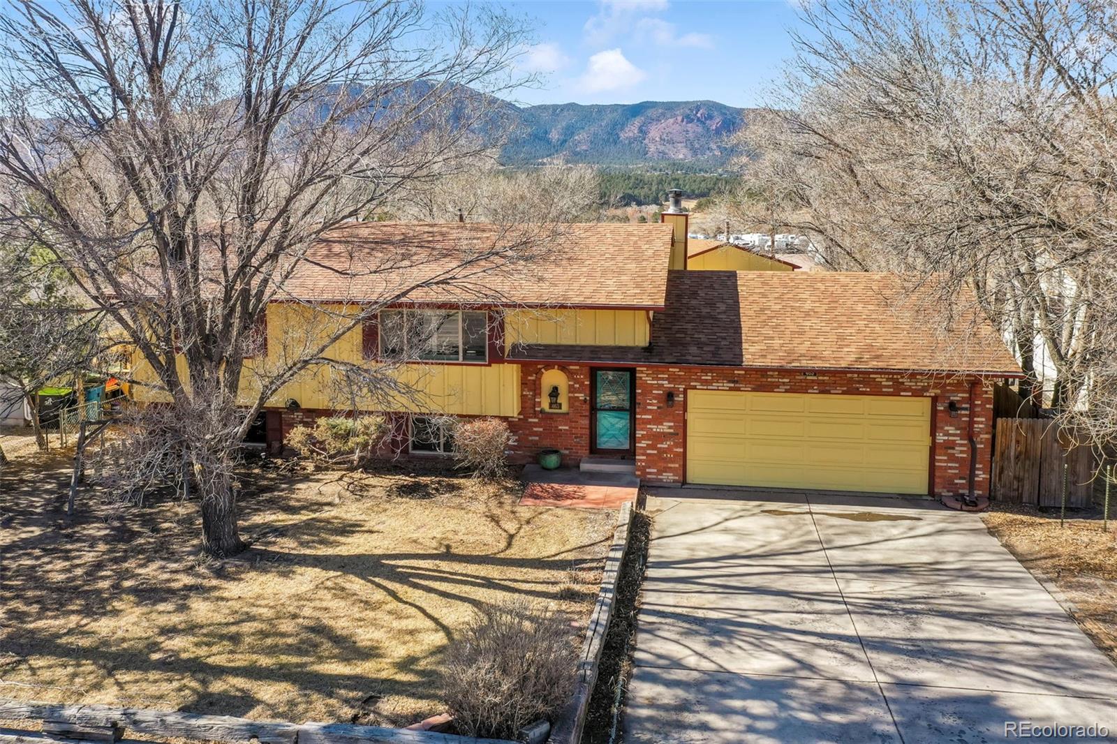463 Washington Street Monument, CO 80132 - Photo 2 of 50 a view of a house with snow on the road