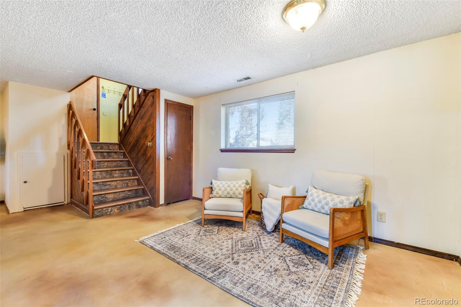 463 Washington Street Monument, CO 80132 - Photo 21 of 50 a living room with furniture and a rug