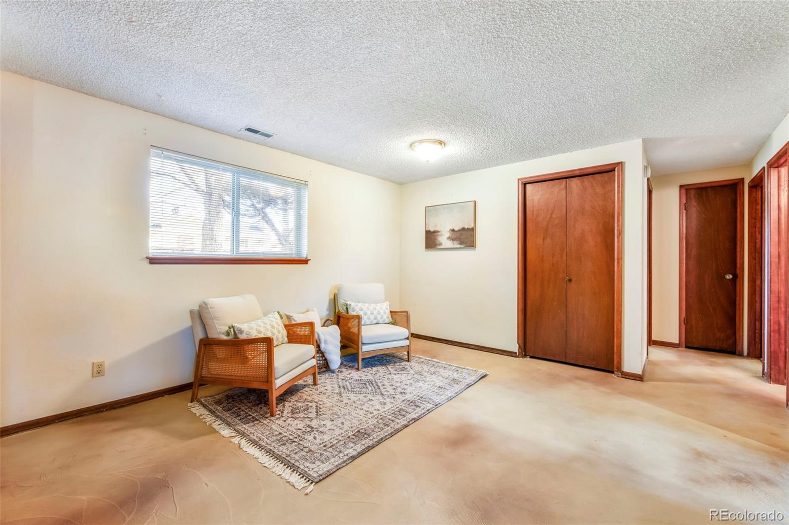 463 Washington Street Monument, CO 80132 - Photo 22 of 50 a living room with furniture and a window