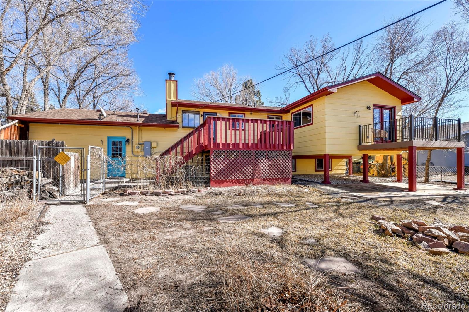 463 Washington Street Monument, CO 80132 - Photo 32 of 50 a view of a house with wooden fence