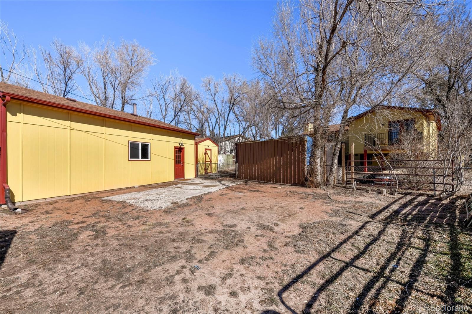 463 Washington Street Monument, CO 80132 - Photo 35 of 50 a backyard of a house with large trees
