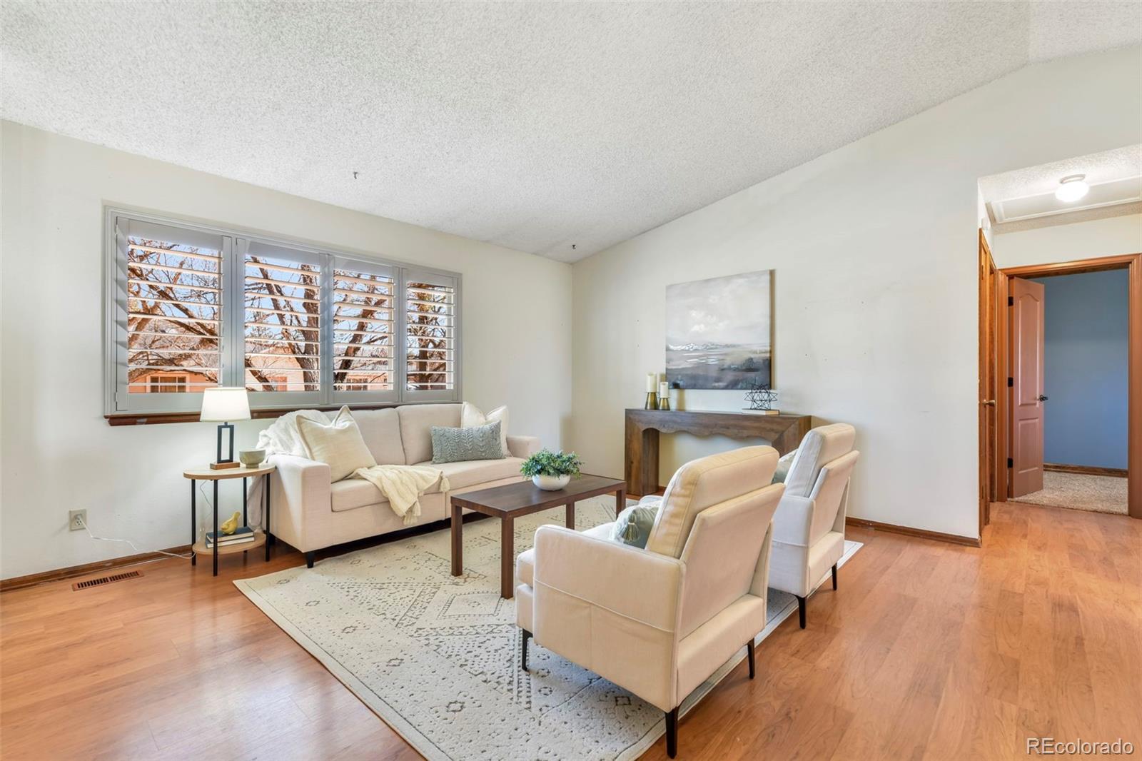 463 Washington Street Monument, CO 80132 - Photo 5 of 50 a living room with furniture and a large window