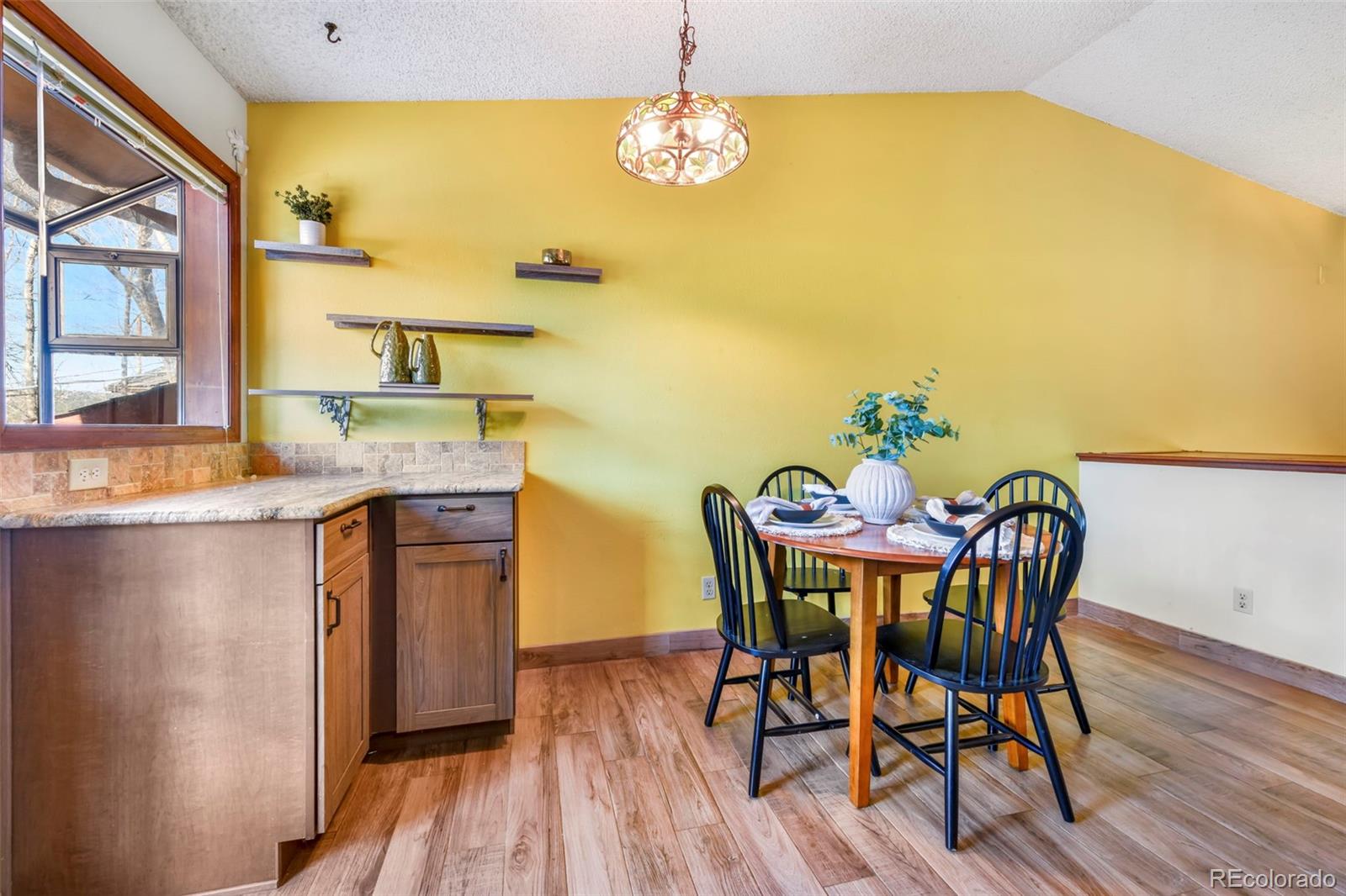 463 Washington Street Monument, CO 80132 - Photo 10 of 50 a view of a dining room with furniture and wooden floor