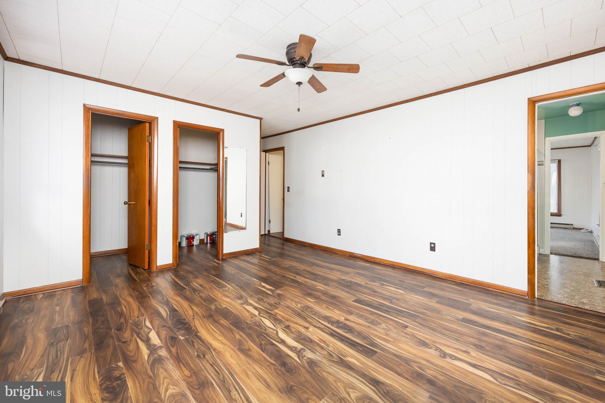 310 Zion Road Salisbury, MD 21804 - Photo 28 of 40 a view of a room with wooden floor and a ceiling fan