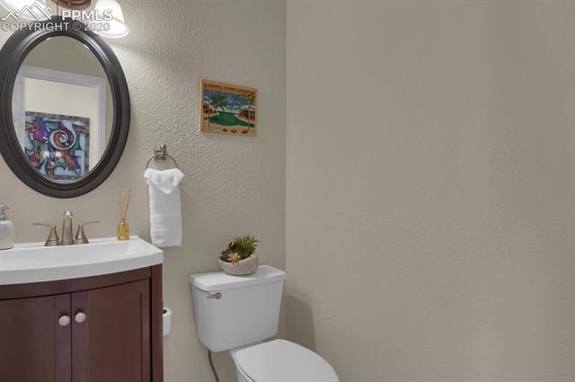 965 Bowstring Road Monument, CO 80132 - Photo 15 of 34 Guest powder room located off the entry.