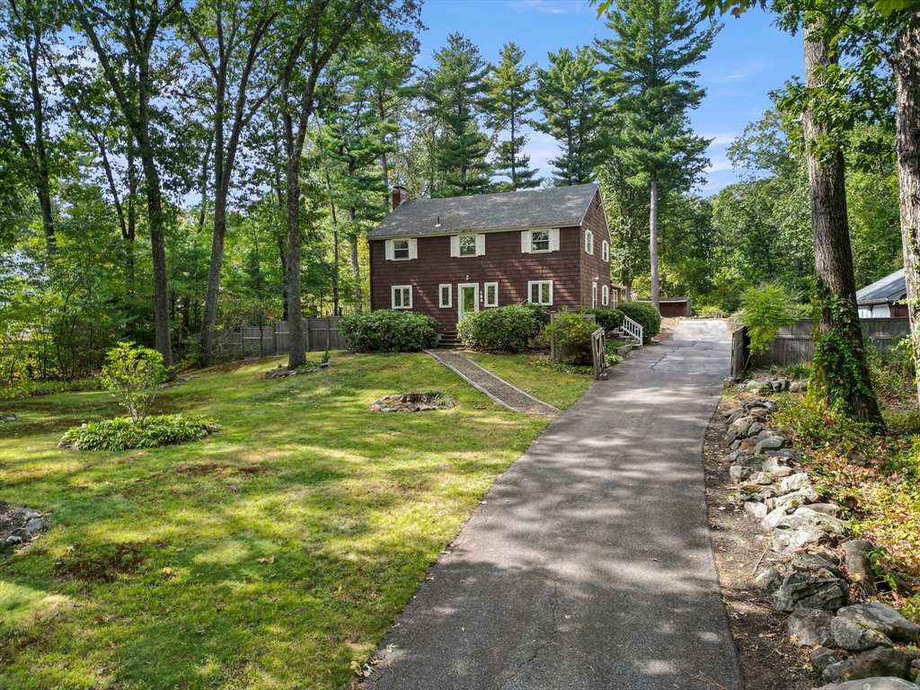 182 Georgetown Road Boxford, MA 01921 - Photo 2 of 41 a view of a big yard with plants and large trees