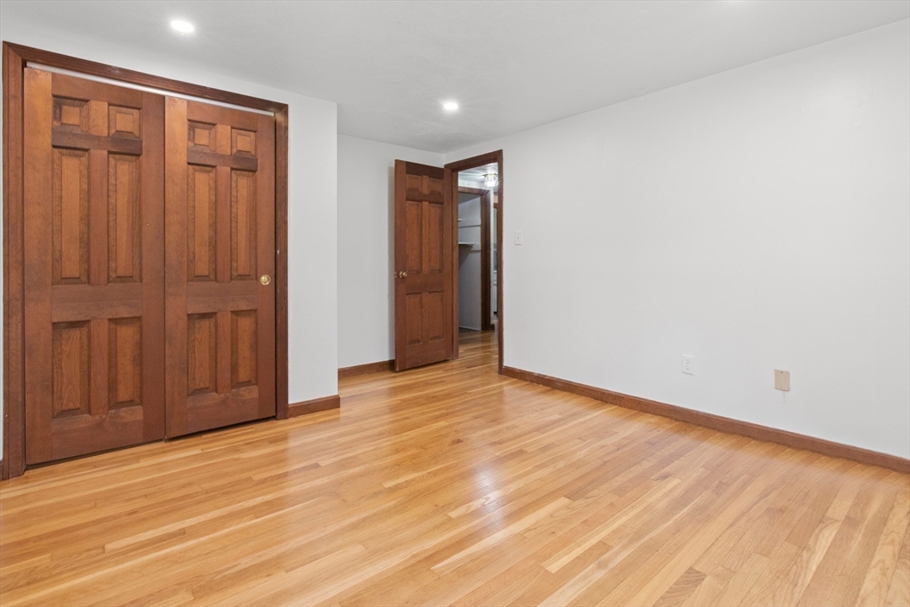 182 Georgetown Road Boxford, MA 01921 - Photo 26 of 41 an empty room with wooden floor and closet area