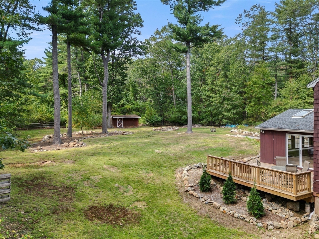 182 Georgetown Road Boxford, MA 01921 - Photo 35 of 41 a view of a house with backyard and sitting area