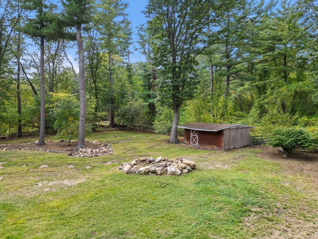 182 Georgetown Road Boxford, MA 01921 - Photo 36 of 41 a view of a backyard with a garden