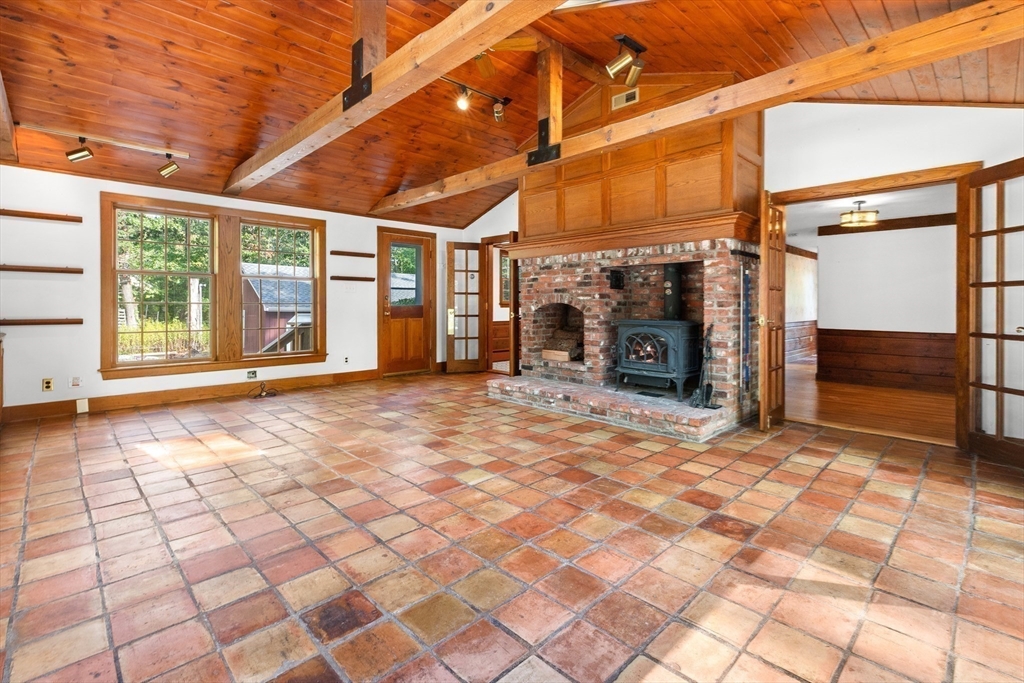 182 Georgetown Road Boxford, MA 01921 - Photo 10 of 41 a view of an empty room with a fireplace