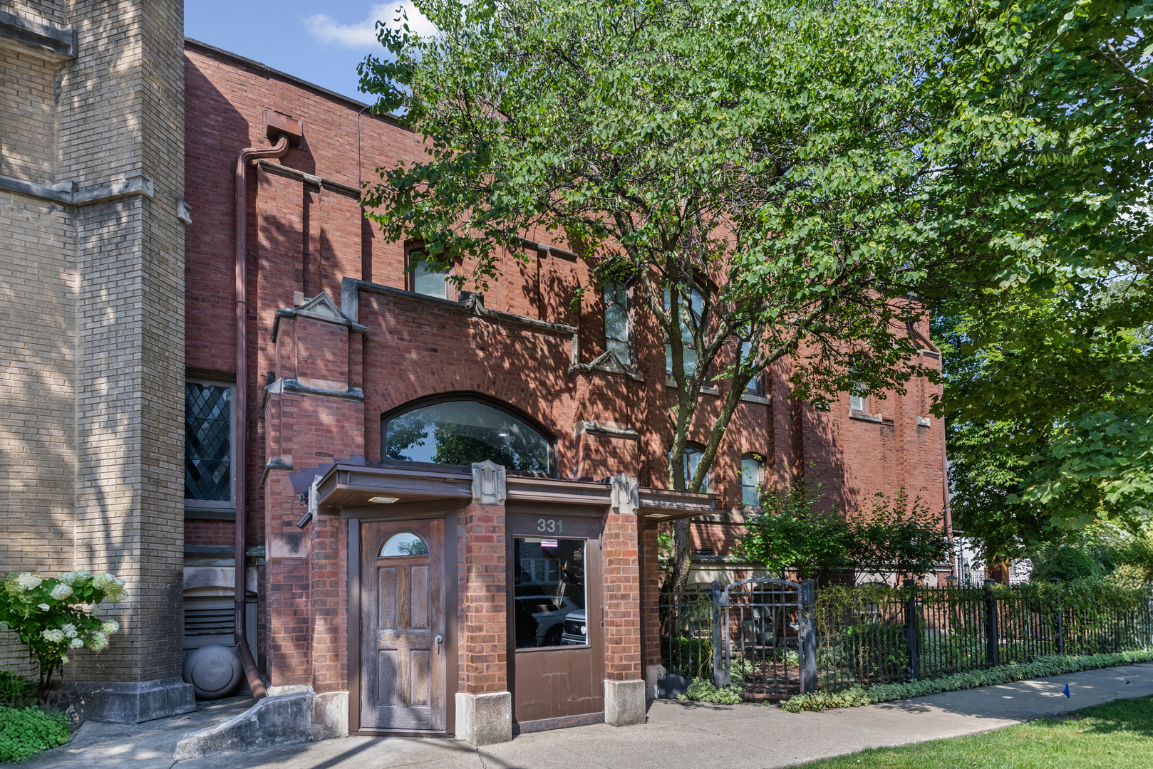 331 South Ridgeland Avenue, Unit B Oak Park, IL 60302 - Photo 1 of 20 a front view of a building with tree s