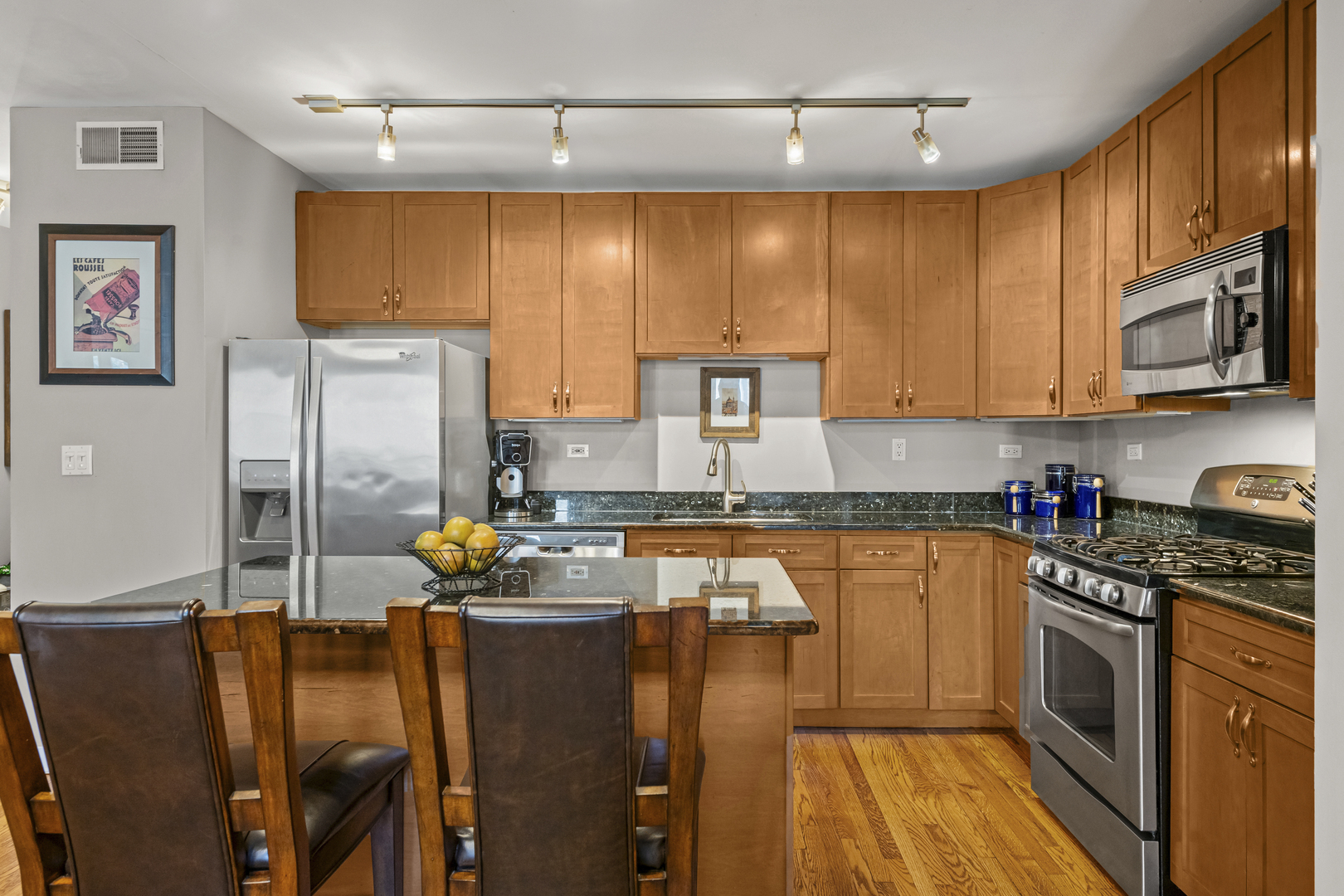 331 South Ridgeland Avenue, Unit B Oak Park, IL 60302 - Photo 3 of 20 a kitchen with stainless steel appliances granite countertop a refrigerator a stove top oven a sink and dishwasher