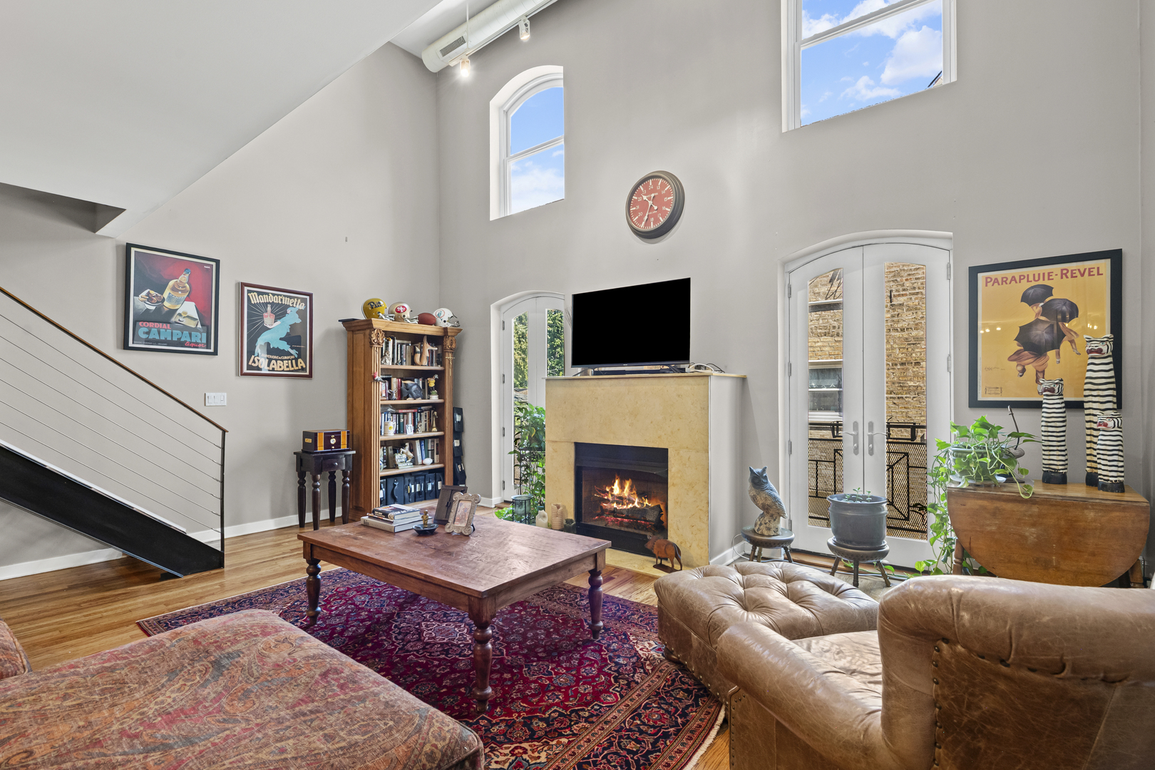 331 South Ridgeland Avenue, Unit B Oak Park, IL 60302 - Photo 8 of 20 a living room with furniture a flat screen tv and a fireplace