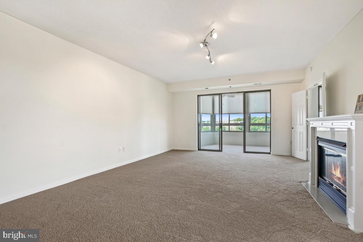 3100 North Leisure World Boulevard, Unit 1007 Silver Spring, MD 20906 - Photo 12 of 55 All new carpeting LR opens to the sunroom