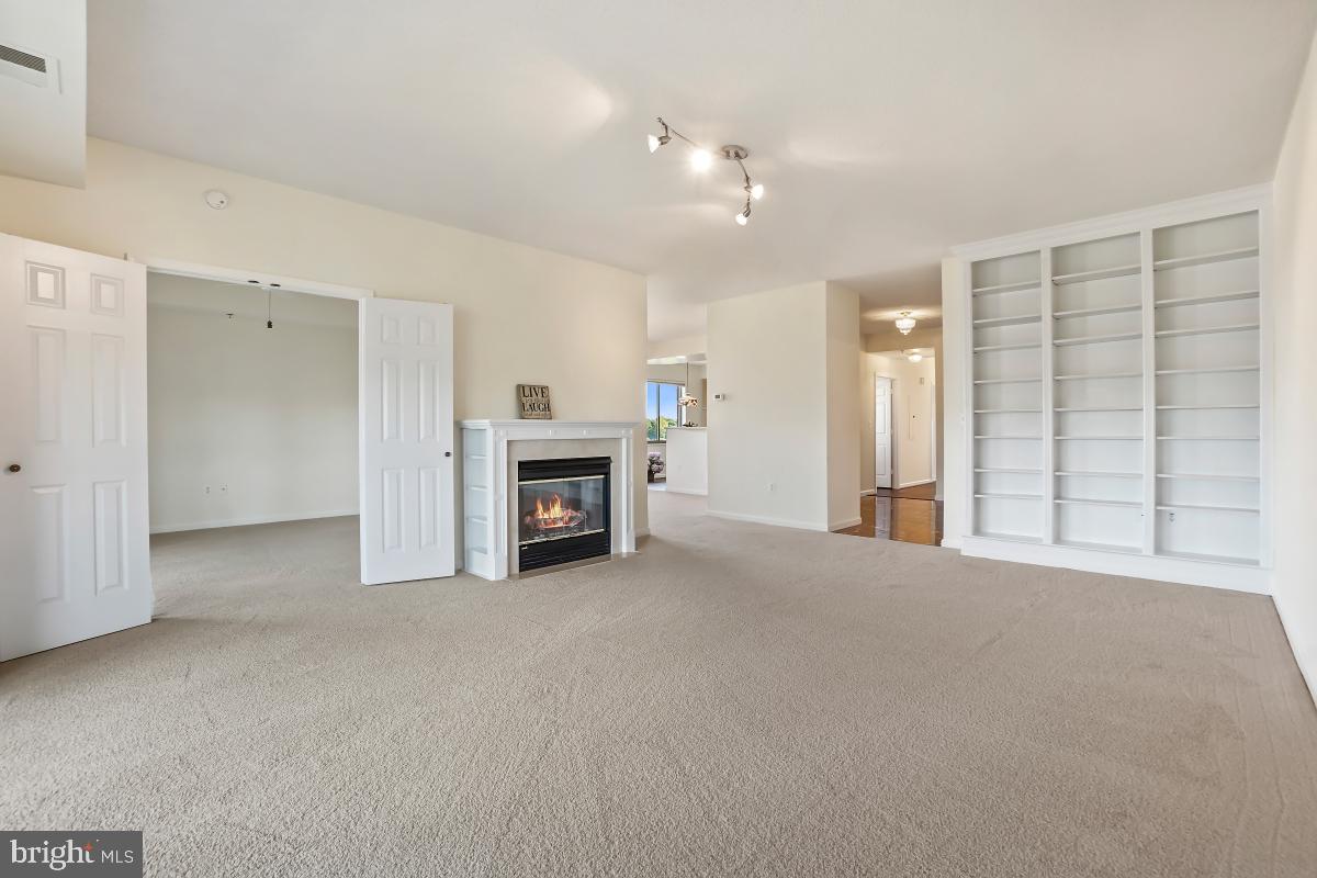 3100 North Leisure World Boulevard, Unit 1007 Silver Spring, MD 20906 - Photo 13 of 55 Spacious Living room with built-in wall unit