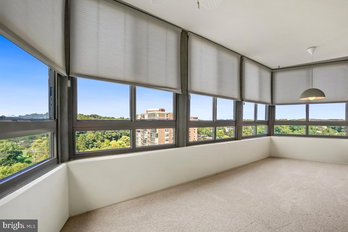 3100 North Leisure World Boulevard, Unit 1007 Silver Spring, MD 20906 - Photo 16 of 55 Huge sunroom with treed view