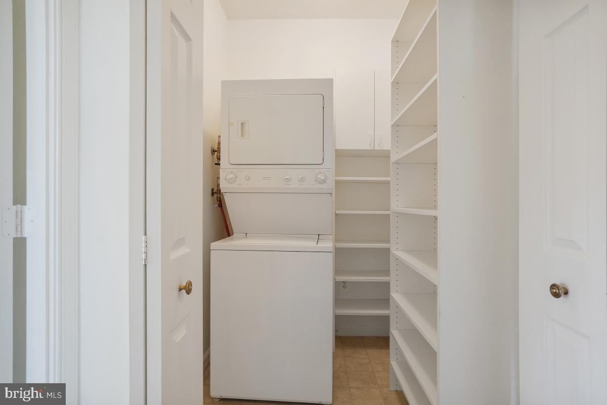 3100 North Leisure World Boulevard, Unit 1007 Silver Spring, MD 20906 - Photo 27 of 55 Laundry room with storage
