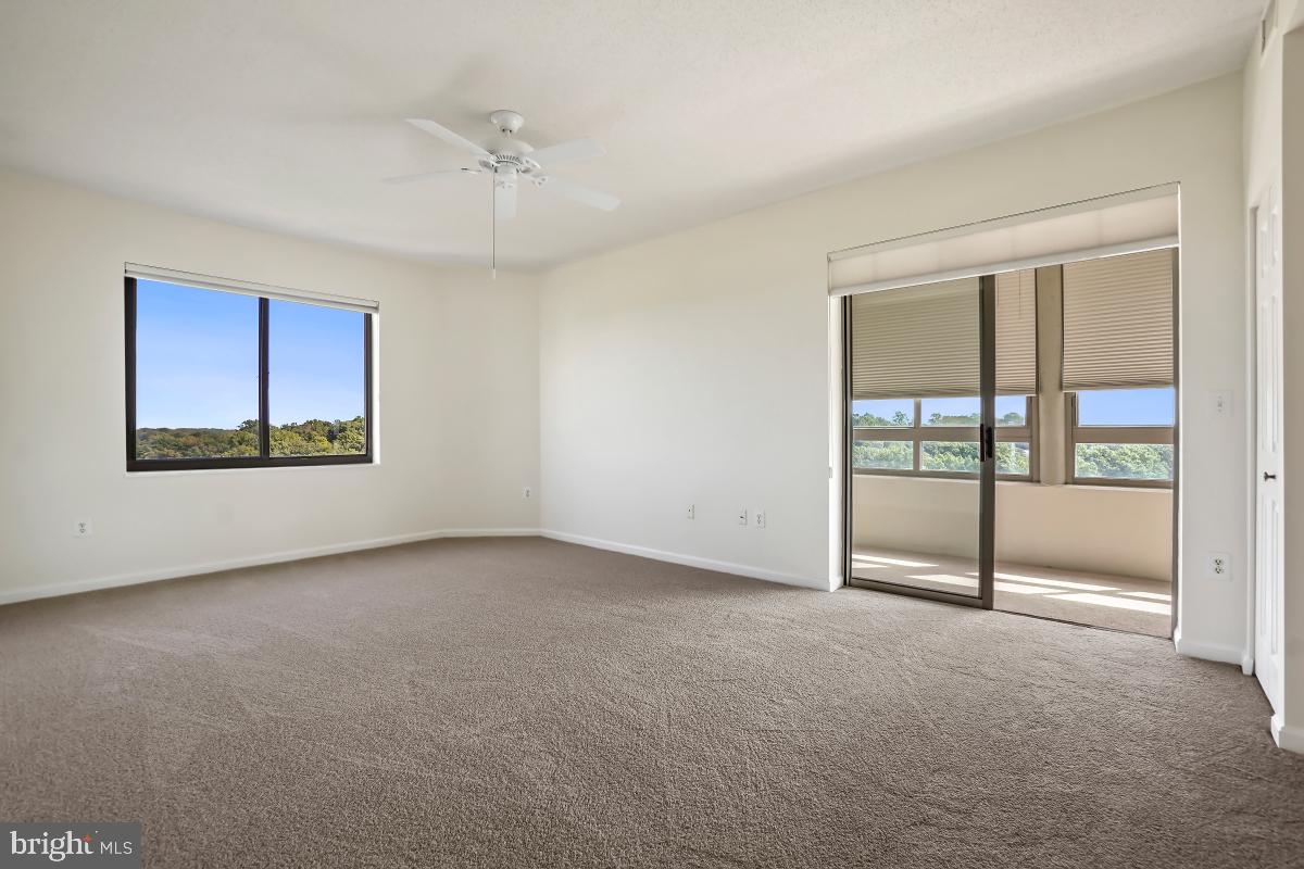 3100 North Leisure World Boulevard, Unit 1007 Silver Spring, MD 20906 - Photo 28 of 55 Primary suite with additional sunroom
