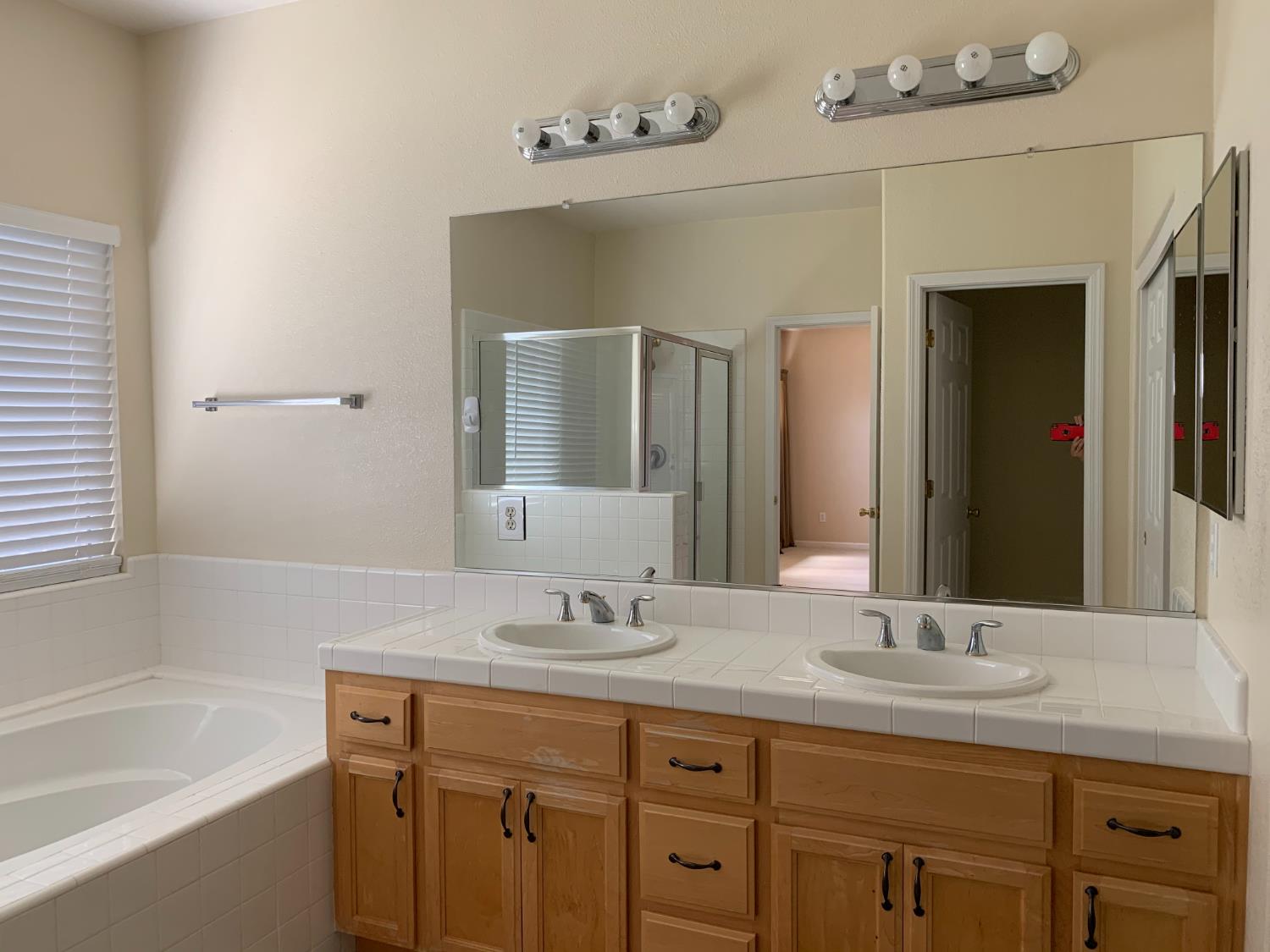 3532 Lauding Way Modesto, CA 95355 - Photo 11 of 21 a bathroom with a granite countertop sink double vanity and a bathtub