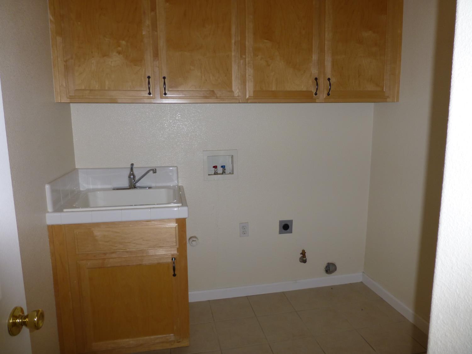 3532 Lauding Way Modesto, CA 95355 - Photo 17 of 21 a bathroom with a sink and cabinets
