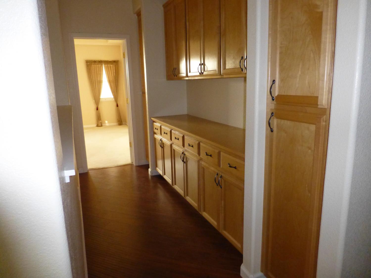 3532 Lauding Way Modesto, CA 95355 - Photo 9 of 21 a view of a hallway with wooden floor