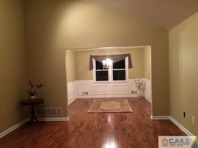 12 Sinclair Road Edison, NJ 08820 - Photo 14 of 18 a view of empty room with wooden floor