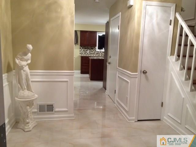 12 Sinclair Road Edison, NJ 08820 - Photo 9 of 18 a view of a hallway with washer and dryer