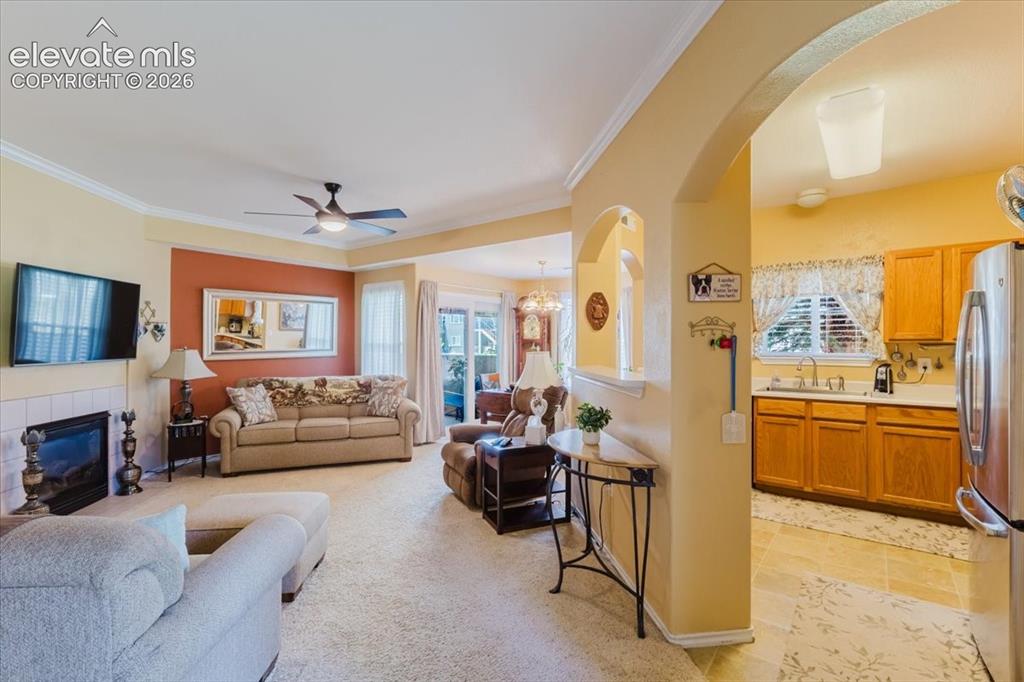 4008 Riviera Grove, Unit 103 Colorado Springs, CO 80922 - Photo 5 of 39 The lovely arch welcomes you into the kitchen.