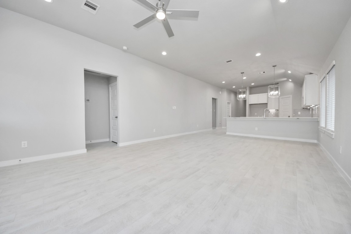 2918 Burris Park Drive Spring, TX 77373 - Photo 14 of 34 an empty room with a garage and kitchen view