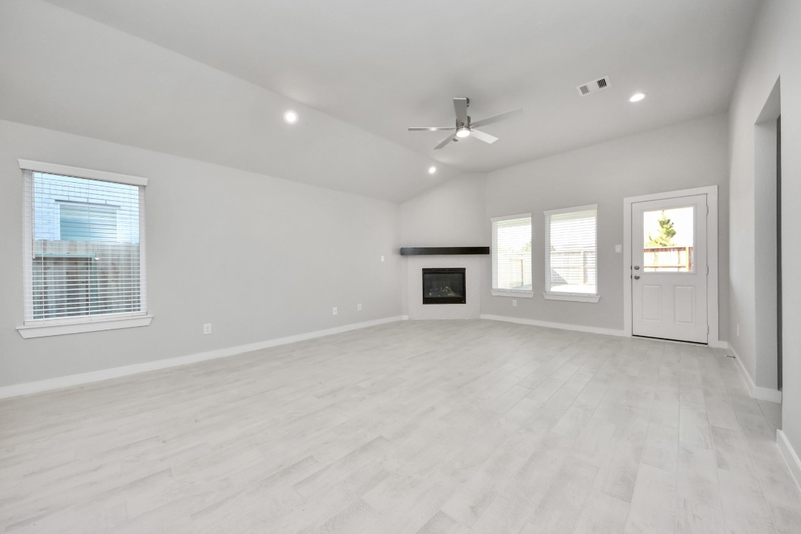 2918 Burris Park Drive Spring, TX 77373 - Photo 16 of 34 an empty room with windows and fireplace