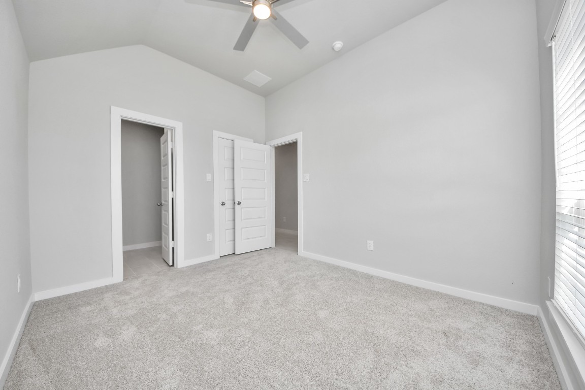 2918 Burris Park Drive Spring, TX 77373 - Photo 25 of 34 an empty room with fan and windows