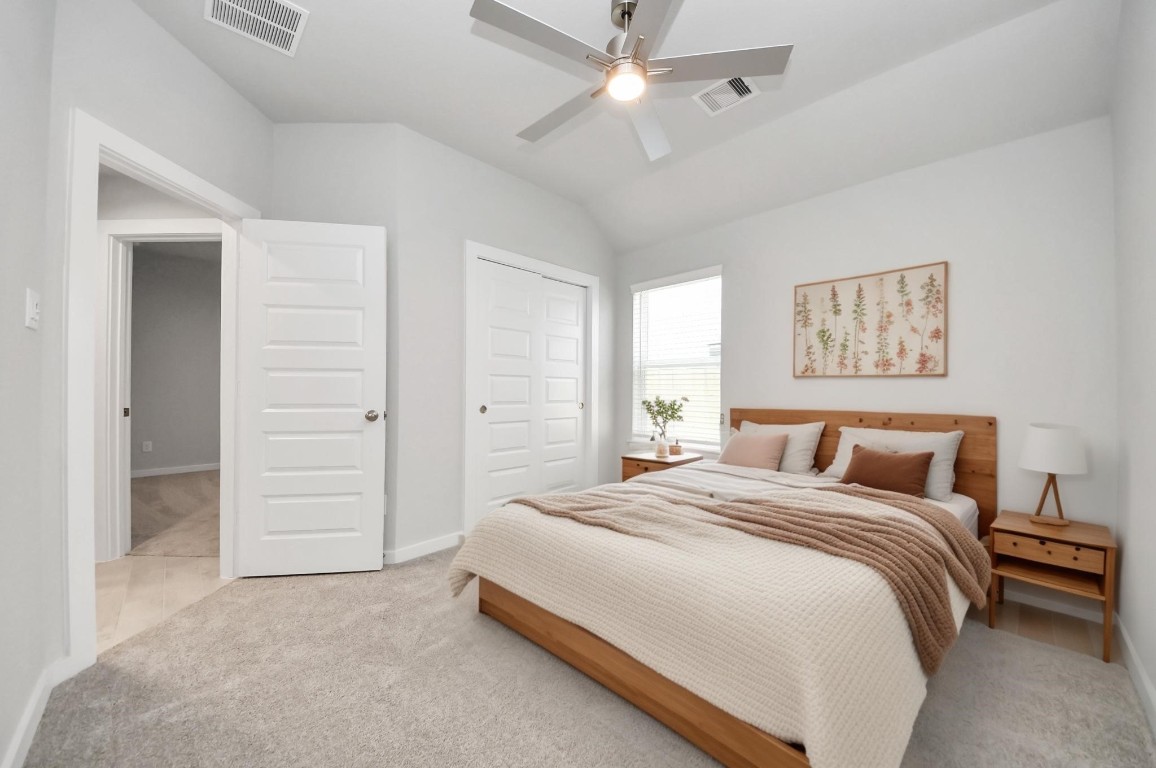2918 Burris Park Drive Spring, TX 77373 - Photo 32 of 34 a bedroom with a large bed and a ceiling fan