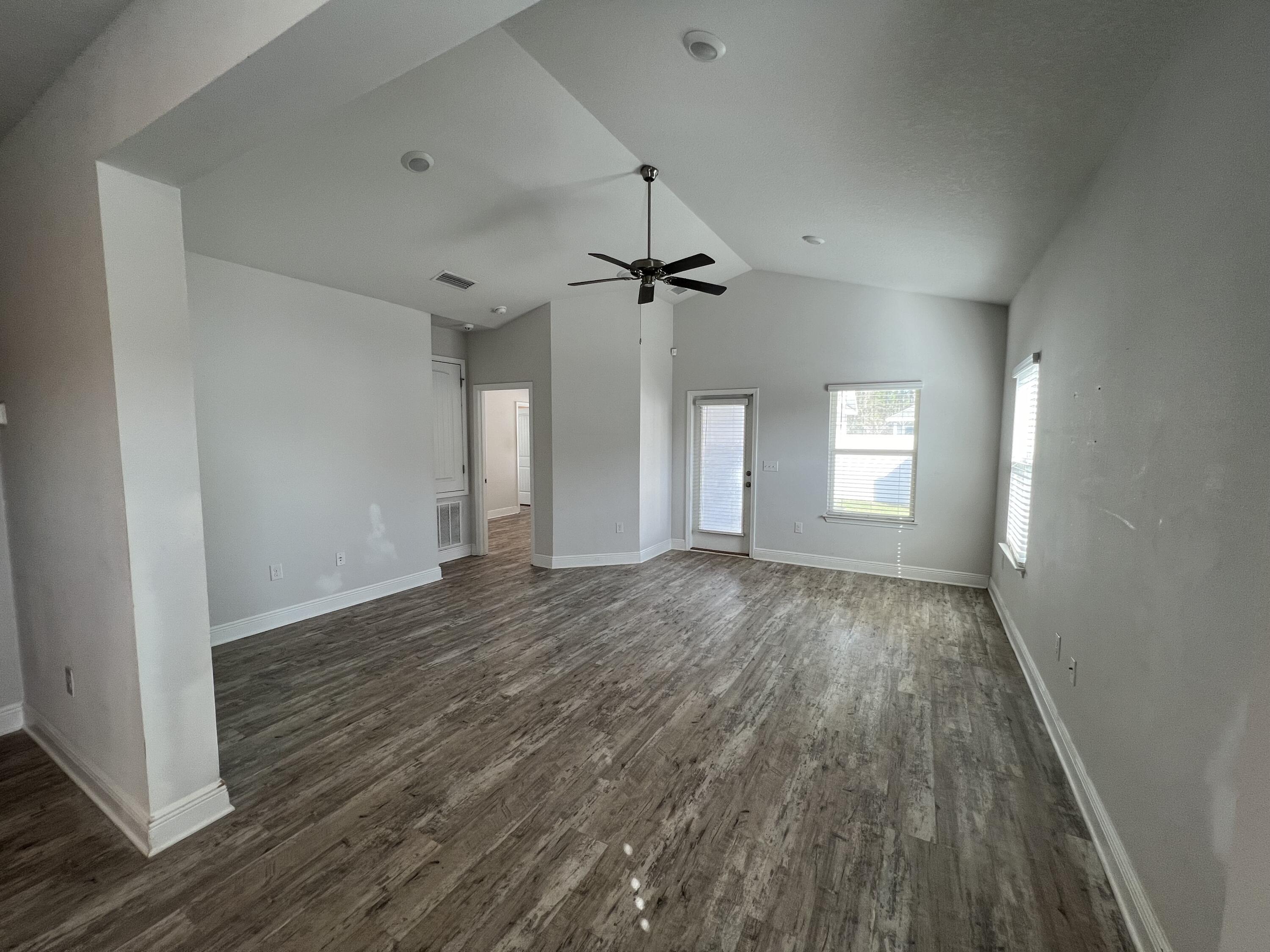 113 Southern Pnes Road Santa Rosa Beach, FL 32459 - Photo 5 of 17 wooden floor in an empty room with a window