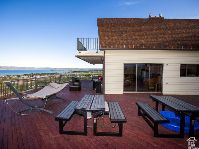 588 Raspberry Patch Road Garden City, UT 84028 - Photo 59 of 74 Deck featuring outdoor dining area, a water view, and area for grilling