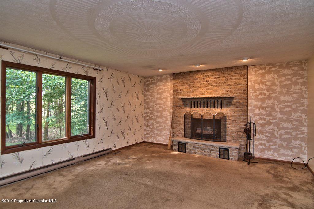 1000 Forest Road Lake Ariel, PA 18436 - Photo 28 of 49 a view of an empty room with a fireplace