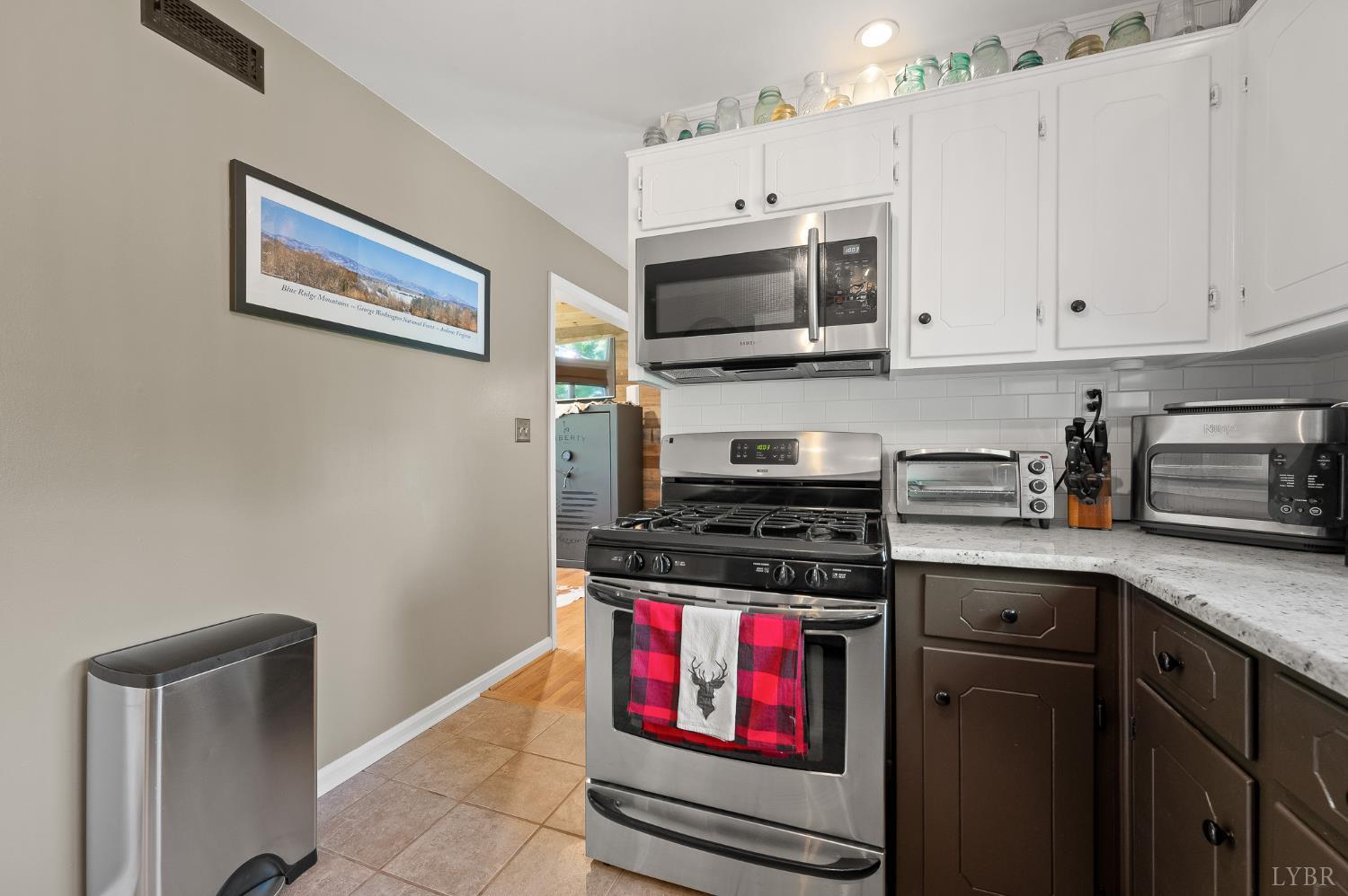 142 Whitehead Drive Amherst, VA 24521 - Photo 14 of 44 a kitchen with stainless steel appliances a stove microwave and sink