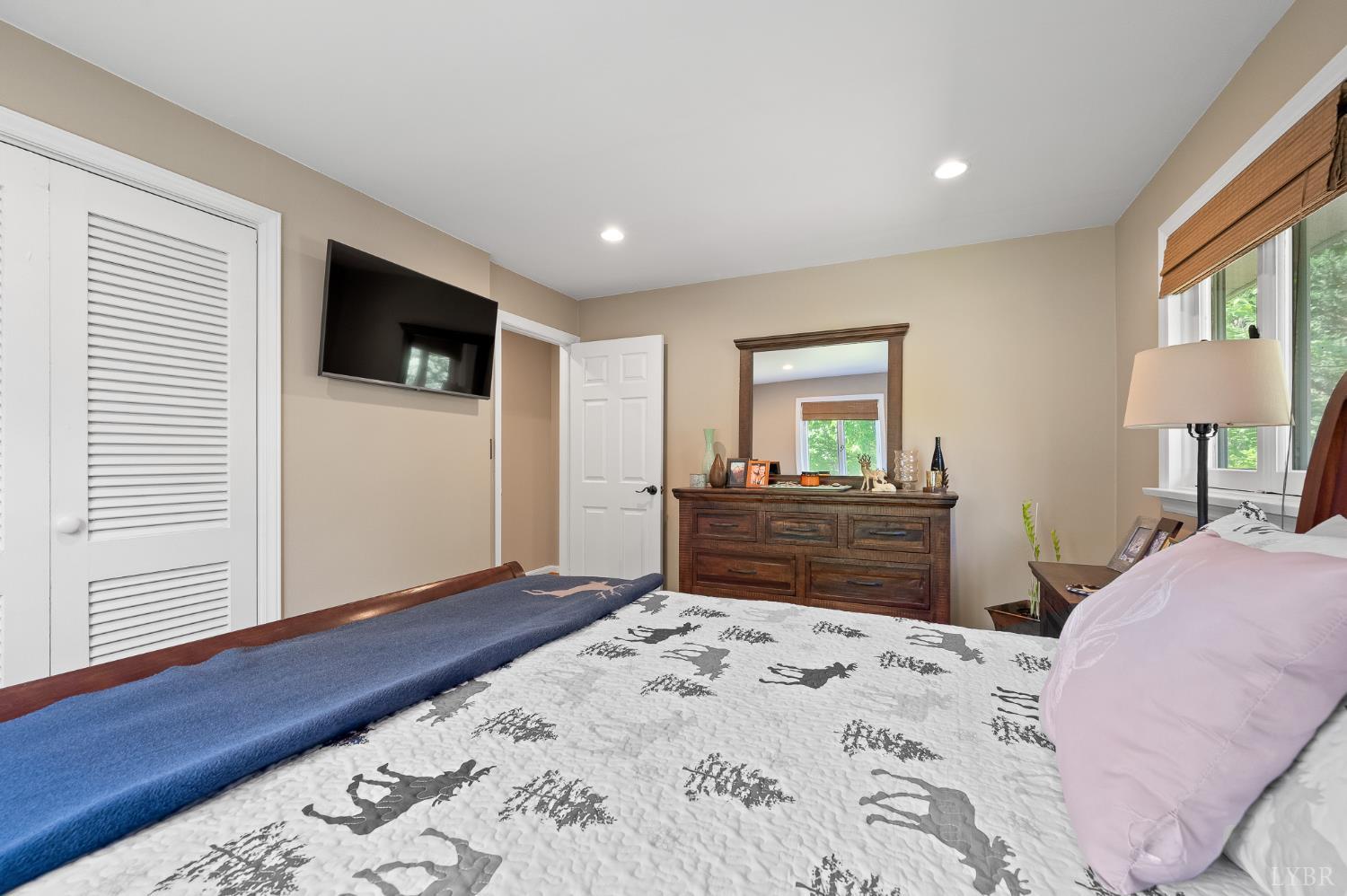 142 Whitehead Drive Amherst, VA 24521 - Photo 20 of 44 a bedroom with a bed and a flat screen tv