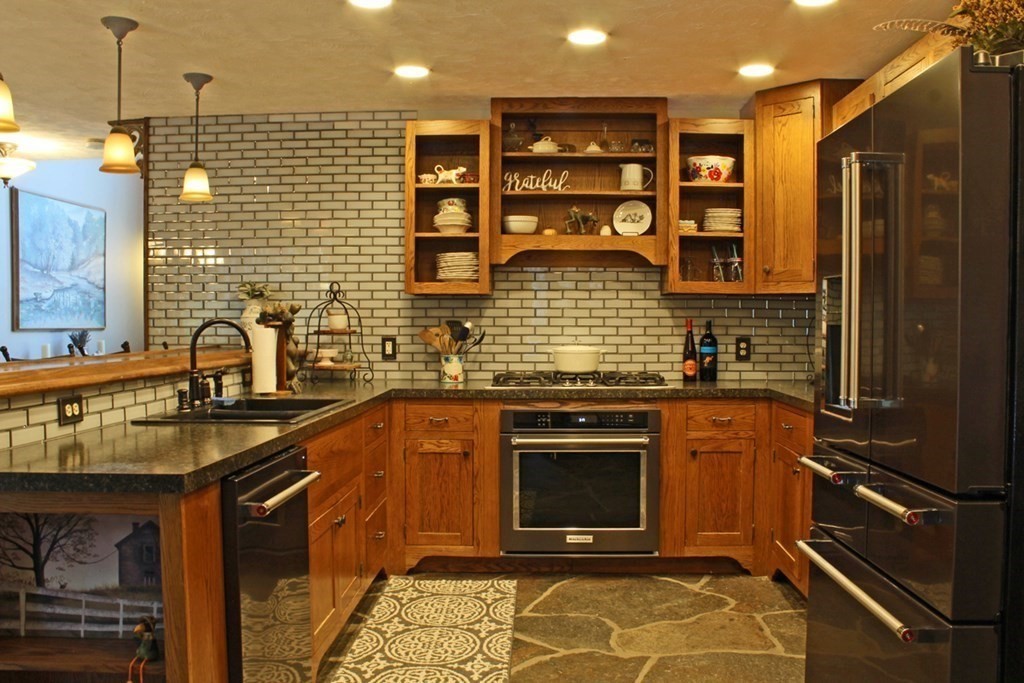 171 River Road Leyden, MA 01337 - Photo 8 of 42 a kitchen with stainless steel appliances granite countertop a stove and a sink