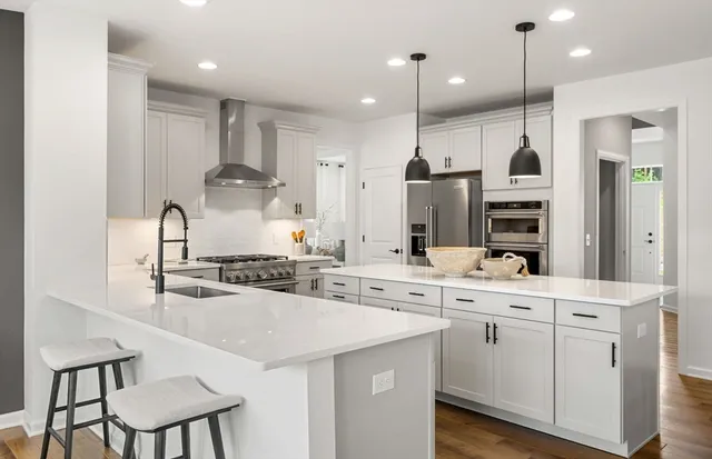 a kitchen with a sink stainless steel appliances and cabinets