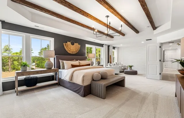 a bed room with a bed and a chair